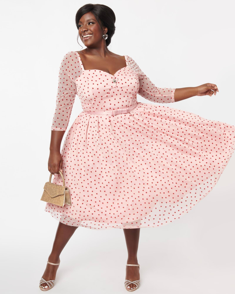 Front of a model wearing a size L Unique Vintage Pink & Red Hearts Lamar Swing Dress in Pink, Polka Dot by Unique Vintage. | dia_product_style_image_id:288552